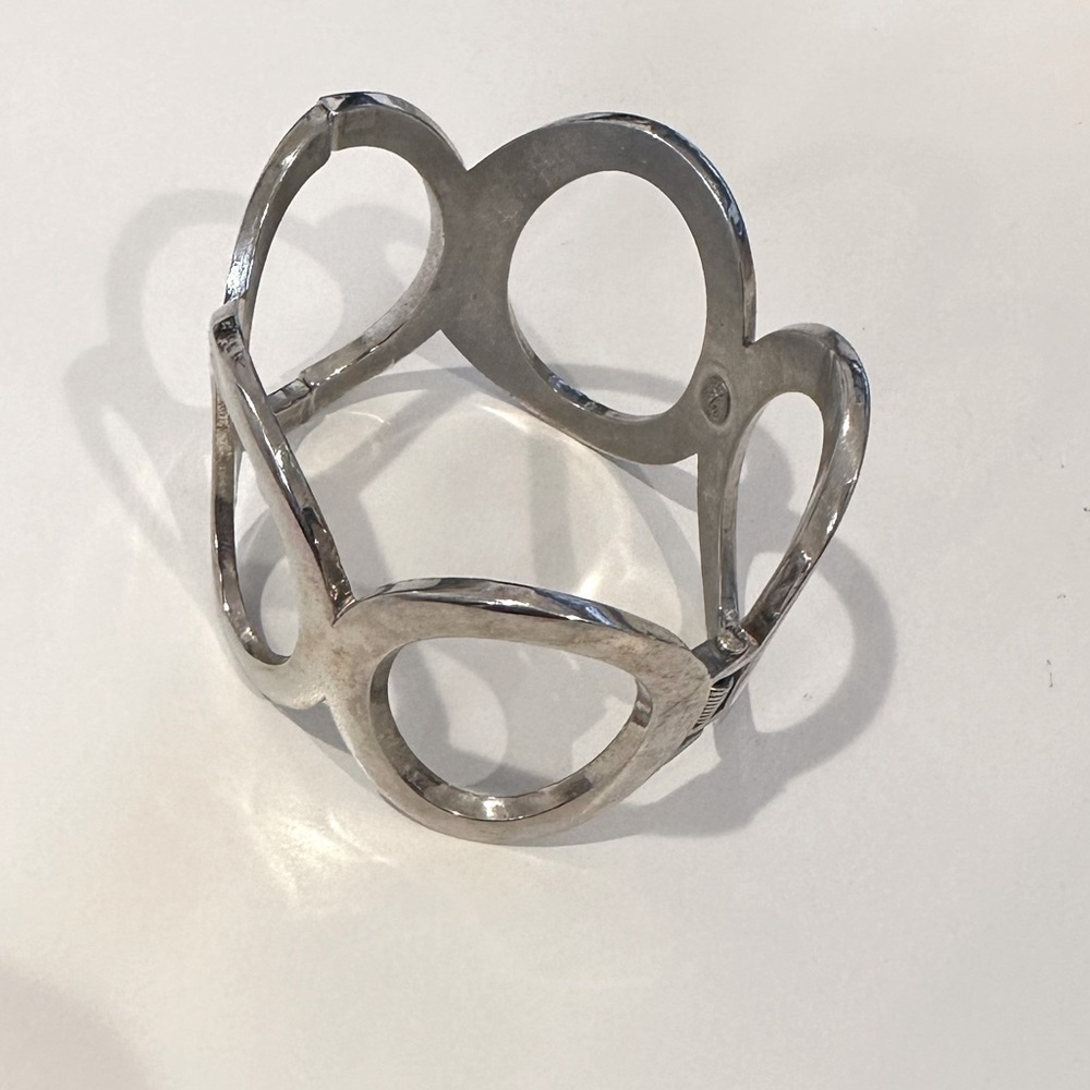 Premier Design (marking) Wide hinged cuff bracelet in silver